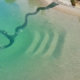 Bio.Design-Pool Nahaufnahme mit Sandlagune im Einstiegsbereich